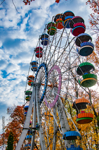 Ferris wheel amuse entertainment and sightseeing in autumn or fall season park outdoor photo