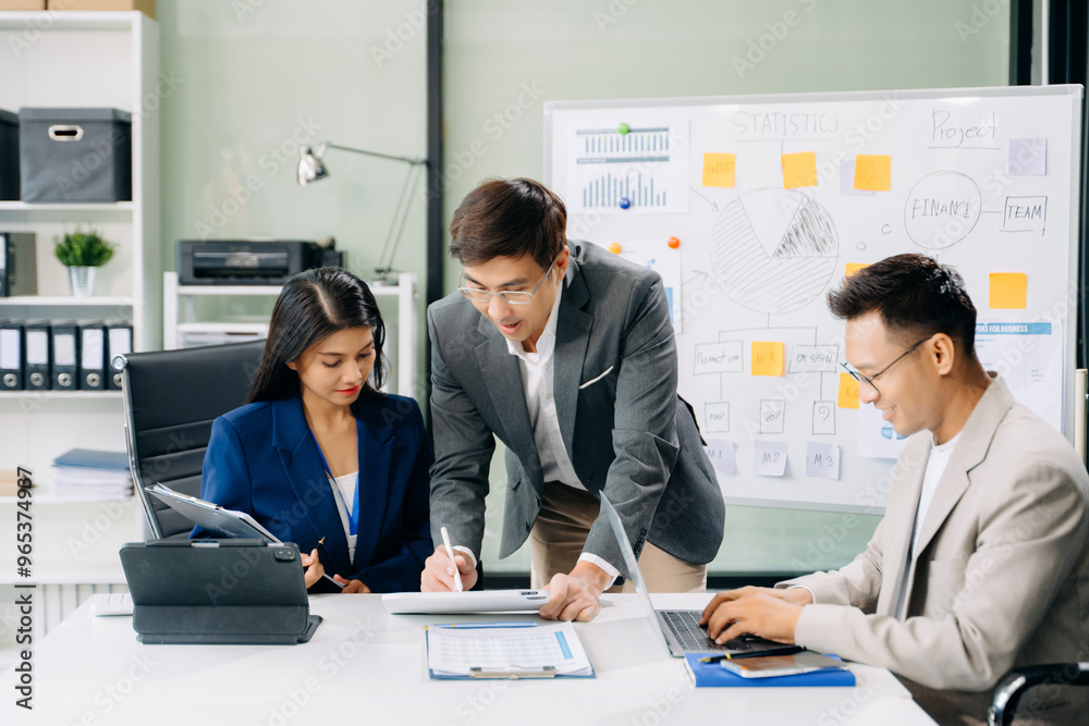 Office colleagues have a casual discussion. During a meeting in a conference room, a group of business teem Office colleagues have a casual discussion. During a meeting in a conference room, a group of business teem