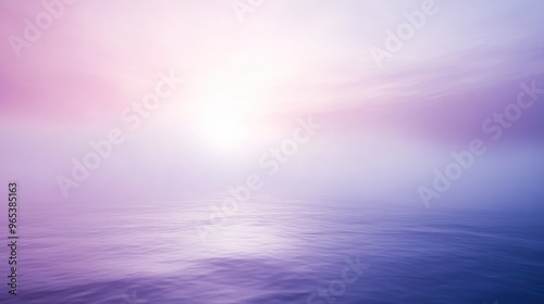 Calm Water and Misty Sunset Sky with Soft Pink and Purple Hues