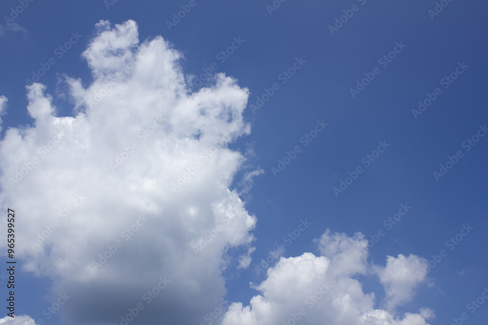 Blue sky with puffy clouds
Blue sky with puffy clouds