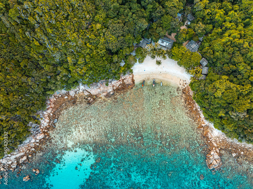 Fototapeta Naklejka Na Ścianę i Meble -  Drone Perspective of Lush Perhentian Islands’ Coastlines
