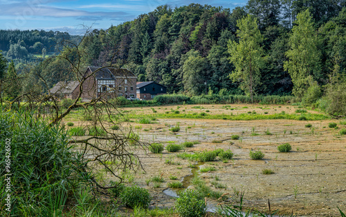 A field of grass and water in Stavelot, Belgium photo
