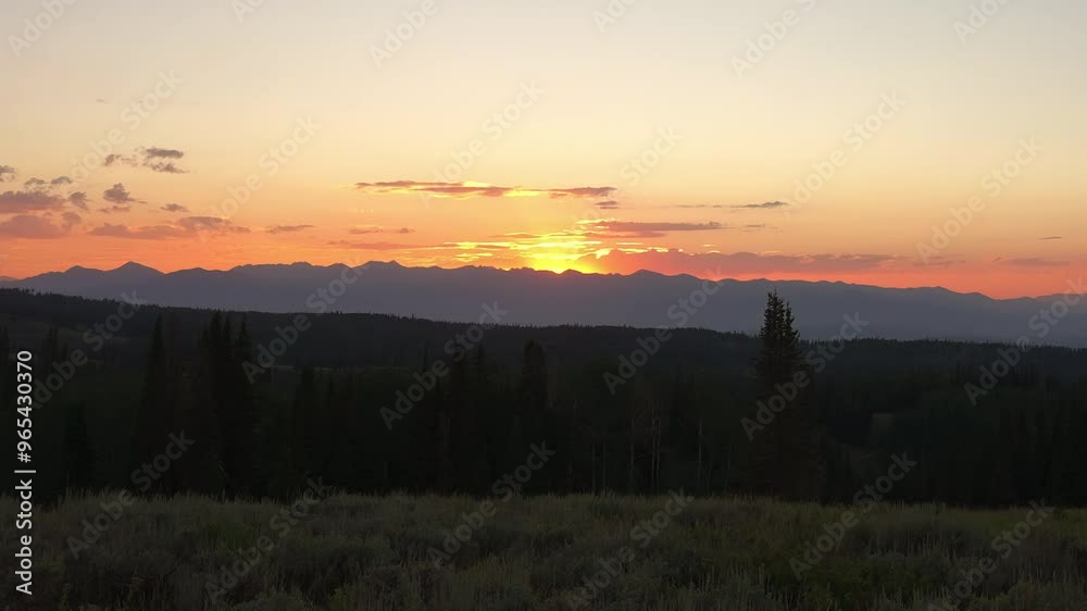 Mountain Peaks With Glowing Golden Evening Light At Sunset In Summertime. Timelapse