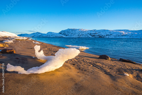 Shore sand of Guba Voronya, Barents Sea bay. Kola Peninsula landscape photo