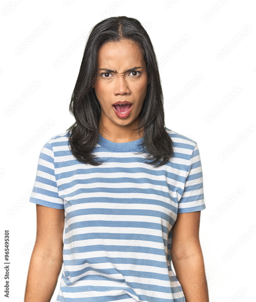 Young Latina posing in studio shouting very angry, rage concept, frustrated. Young Latina posing in studio shouting very angry, rage concept, frustrated.