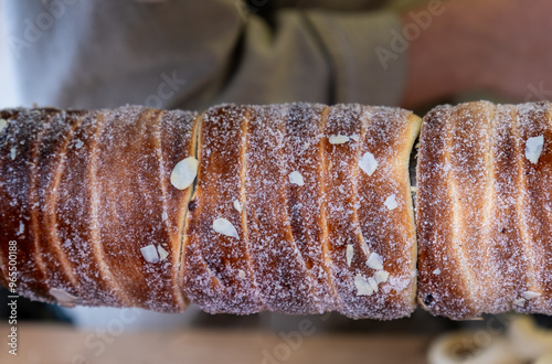 Photography Sweet chimney cake - Trdelnik or Kurtos Kalacs sell at Christmas market in Pragu