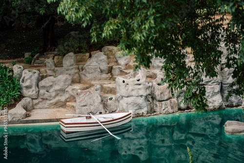 pond with a boat in the garden of Yildiz Palace in Istanbul photo