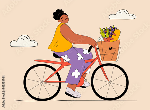 Happy diverse Afro girl riding a bicycle