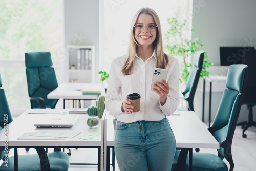 Portrait of professional corporate worker lady smart phone coffee cup modern office indoors