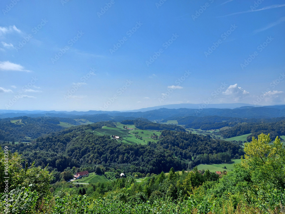 landscape of Slovenia under blue sky. Green hills and vineyards landscape of Slovenia under blue sky. Green hills and vineyards