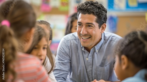 Friendly male teacher standing in front of pupils during a lesson, back to school moment
