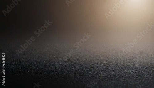 Dark textured surface with blurred golden light.