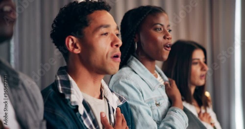 Friends, singing and national anthem in home for sports game, support and watching tv with diversity. People, pride and fans for television, soccer and song with streaming, solidarity and respect