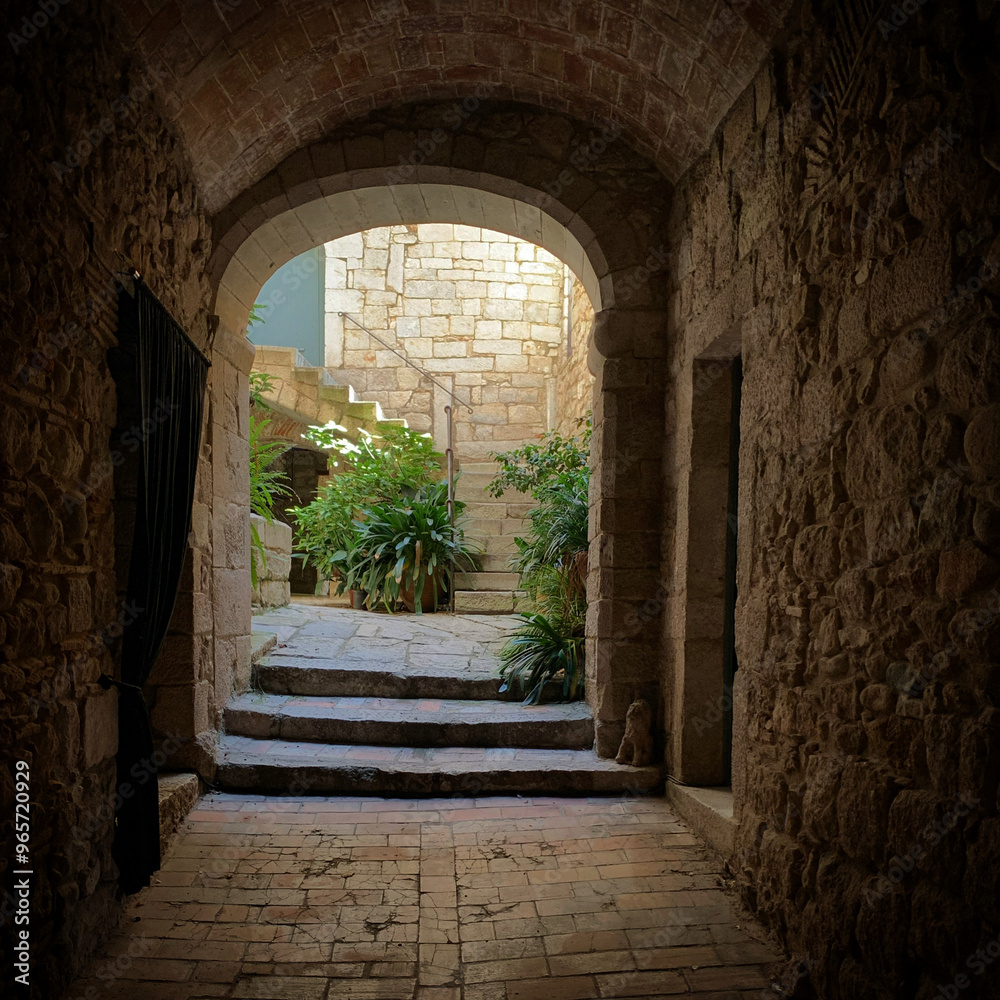 Obraz premium Entrance to the historic courtyard in the old town Girona, Catalonia, Spain, September 2019