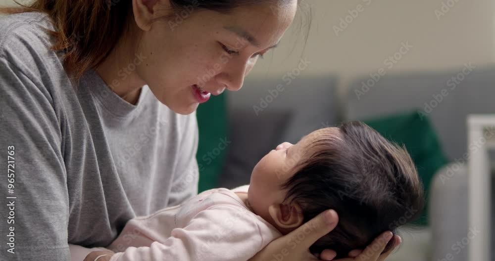A caring mother soothing her baby girl to sleep with gentle words and loving eye contact at home, demonstrating dedication and affection in a nurturing environment A caring mother soothing her baby girl to sleep with gentle words and loving eye contact at home, demonstrating dedication and affection in a nurturing environment
