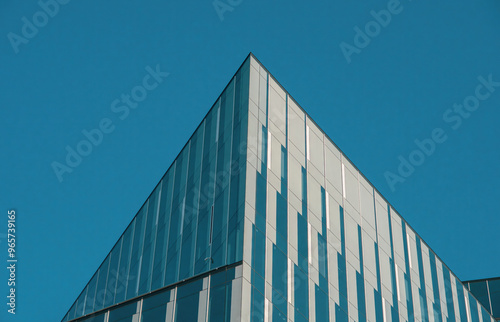 Fragments of modern buildings against the sky, capturing sleek lines, glass reflections, and bold architectural details, blending urban design with the open expanse of the horizon.