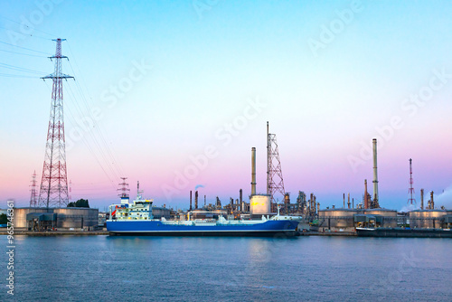 Oil ship docked at the oil berth in oil refinery.
