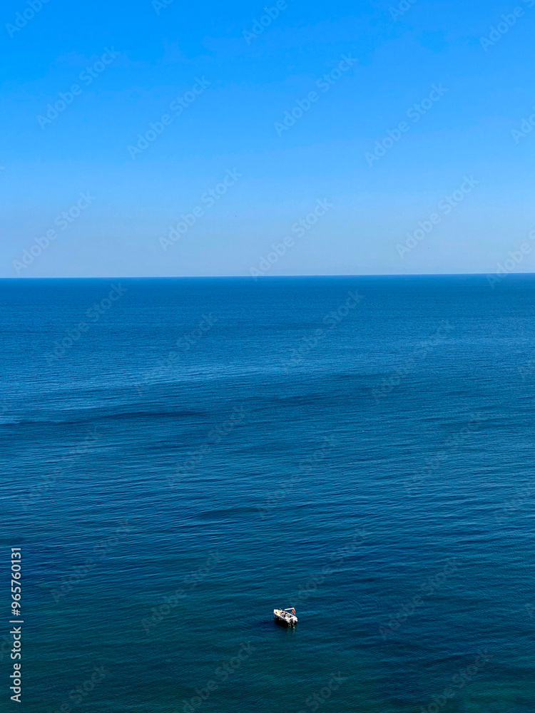 Aerial view of a boat in the sea on a sunny day