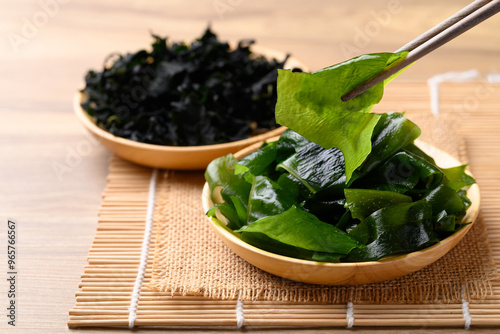 Fresh Wakame seaweed or sea mustard with chopsticks photo