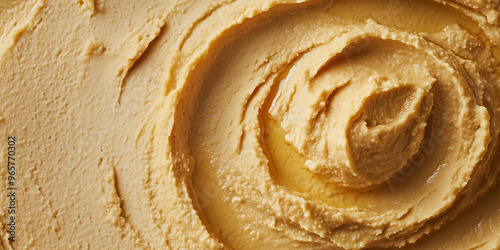 Close-up of hummus in a wide bowl with a smooth, undisturbed surface photo