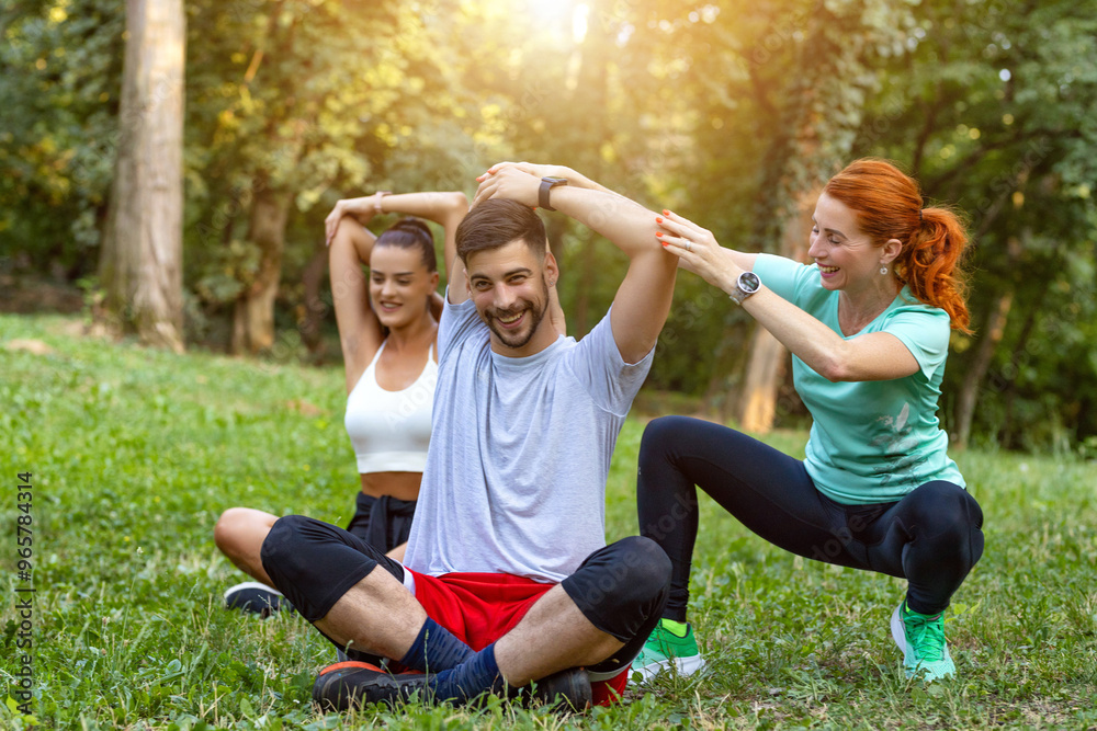 Women instructor helping young handsome men to stretch after training ...