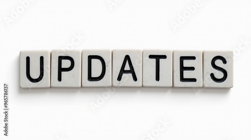 Updates text carved in stone blocks on white background