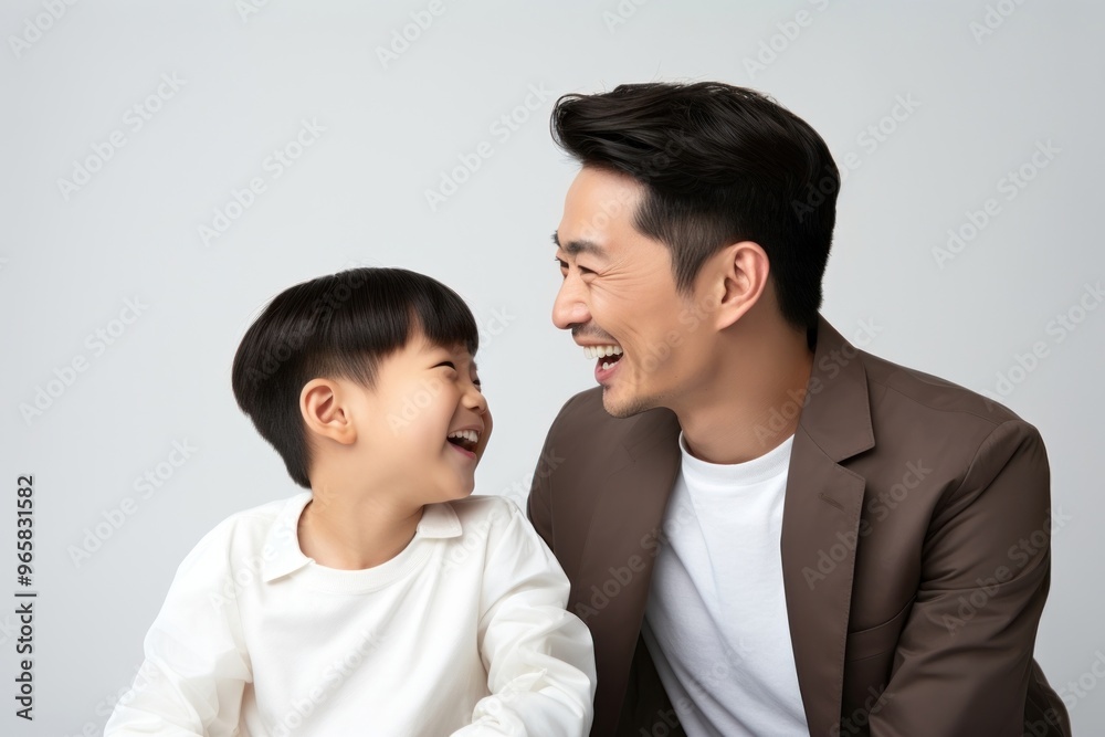 Asian happy father and son child laughing adult togetherness. Asian happy father and son child laughing adult togetherness.