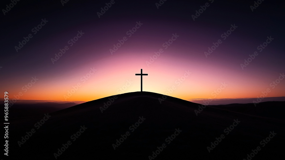 Silhouette of a cross on a hill at sunset with a vibrant sky ranging from orange to purple hues. The horizon features distant mountains and a gradient sky.