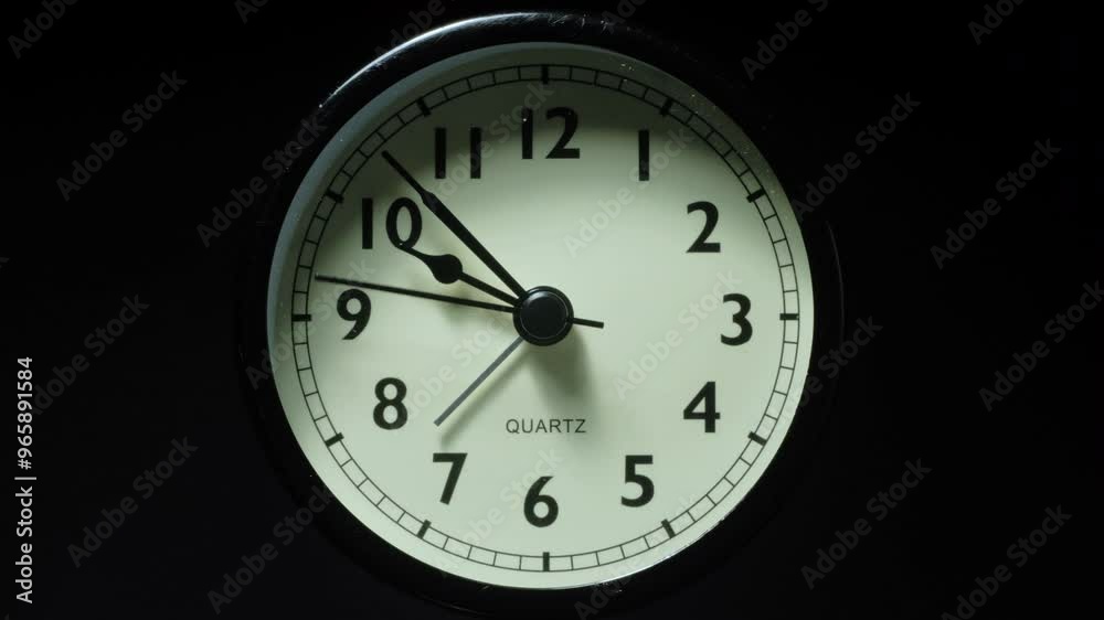 The alarm clock on a black background, in the style of time-lapse video. The alarm clock on a black background, in the style of time-lapse video.