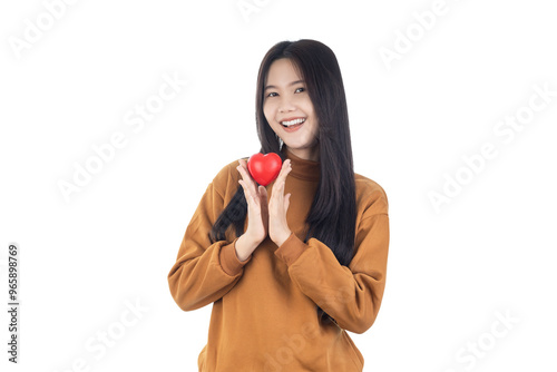 Young Asian woman holding red heart isolated on white background with clipping path. Health insurance, donation charity concept.