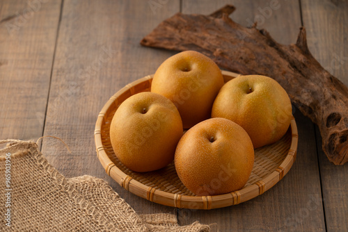 Japanese pears,Asian pears. Asian pears: any of a variety of pears, mainly of Japanese and Chinese origin, with crisp, juicy flesh and typically have yellow, brown, or green skin. 