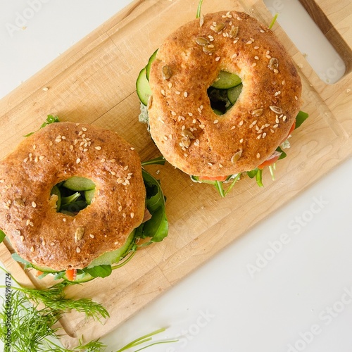 Wallpaper Mural Homemade Bagels with Sesame Seeds, Salmon, Cucumber and Herbs Served Torontodigital.ca