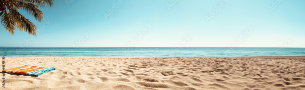 A tranquil beach scene featuring a striped beach towel on the sandy shore, with gentle waves of a calm ocean in the background. A palm tree's fronds are visible in the top left corner. A tranquil beach scene featuring a striped beach towel on the sandy shore, with gentle waves of a calm ocean in the background. A palm tree's fronds are visible in the top left corner.