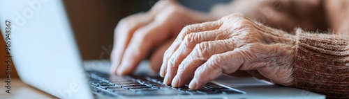 Elderly Hands Typing on Lap...