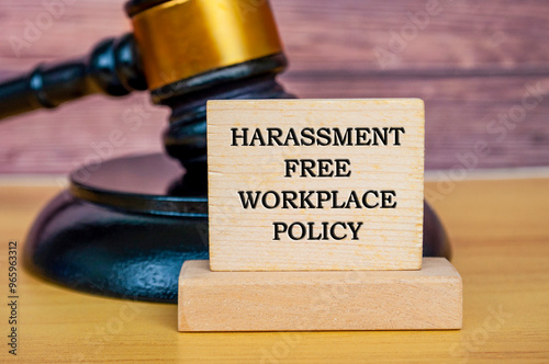 Harassment free workplace policy text written on wooden board with gavel background. Safe workplace concept photo