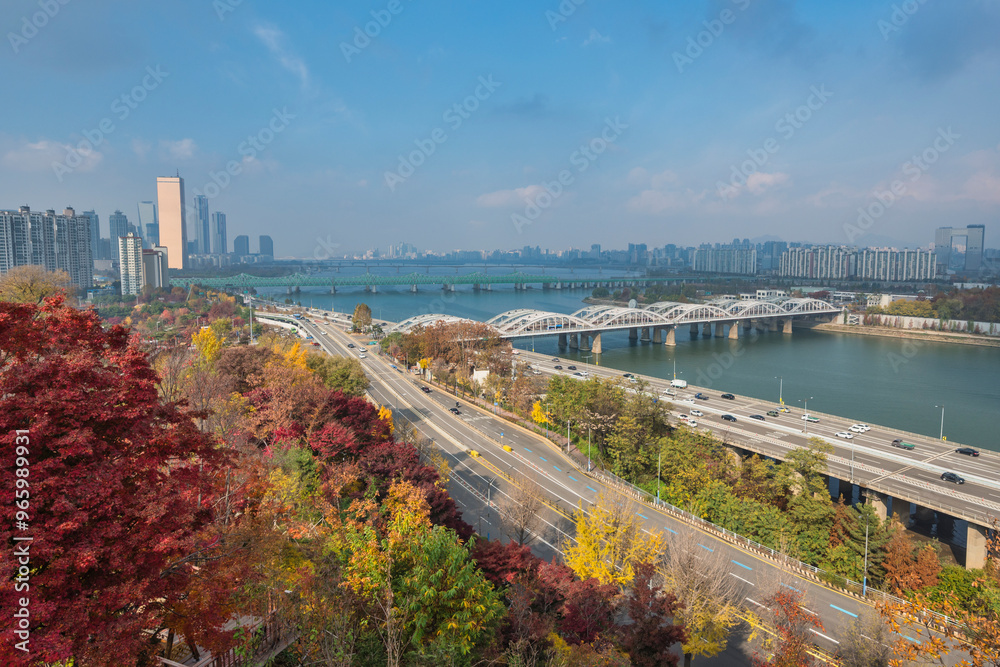 Seoul South Korea city skyline at Yeouido Island and Han River view from Yongbongjeong Park in autumn