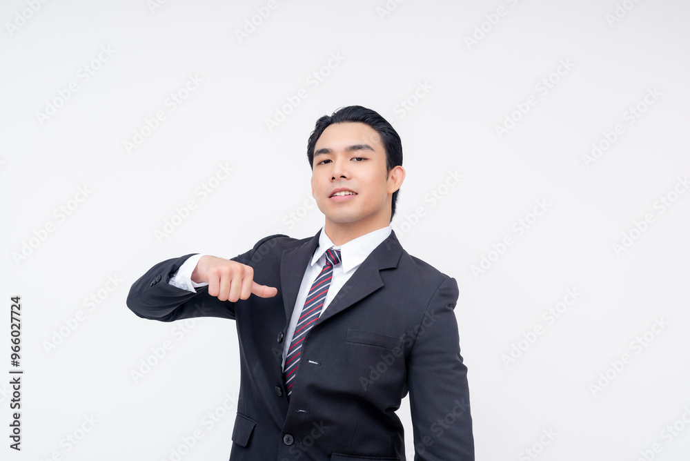 A cocky young asian business executive pointing to himself, reminding that he is the boss. Isolated on a white background. A cocky young asian business executive pointing to himself, reminding that he is the boss. Isolated on a white background.