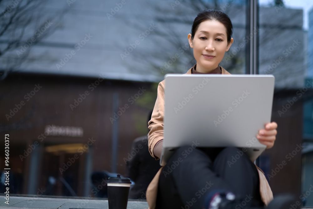 Focused Professional Engaged in Work at a Cozy Urban Caf� Focused Professional Engaged in Work at a Cozy Urban Caf�