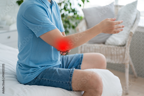Diseases of the elbow joint, bone fracture and inflammation, man suffering from pain in cubit photo