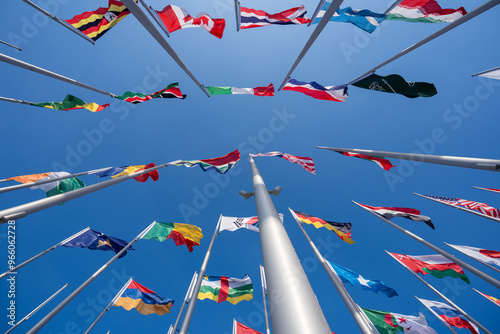 Various flags of the world against the blue sky.