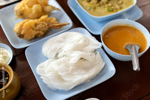 Kanom jeen nam ya ; Rice noodles in fish curry sauce. Traditional Thai cuisine, rice vermicelli served. photo