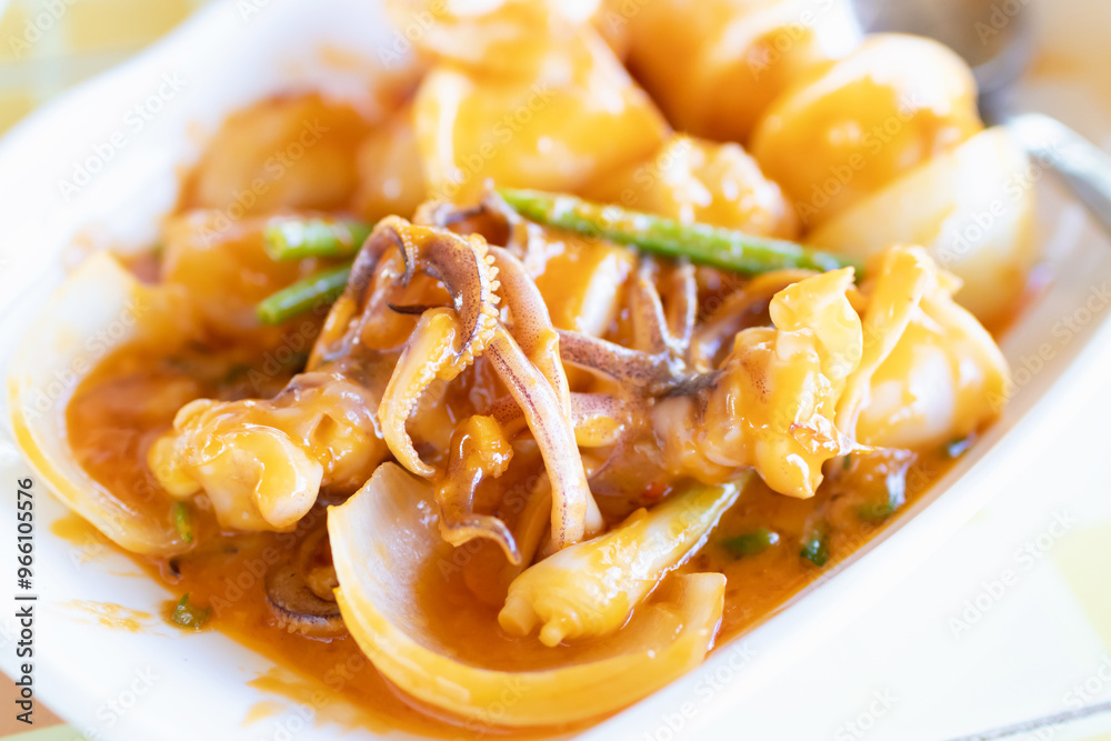 Stir fried squid with salted egg york. Delicious Thai dish.