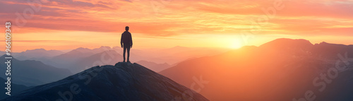 On a mountaintop at dawn, ready to face new challenges