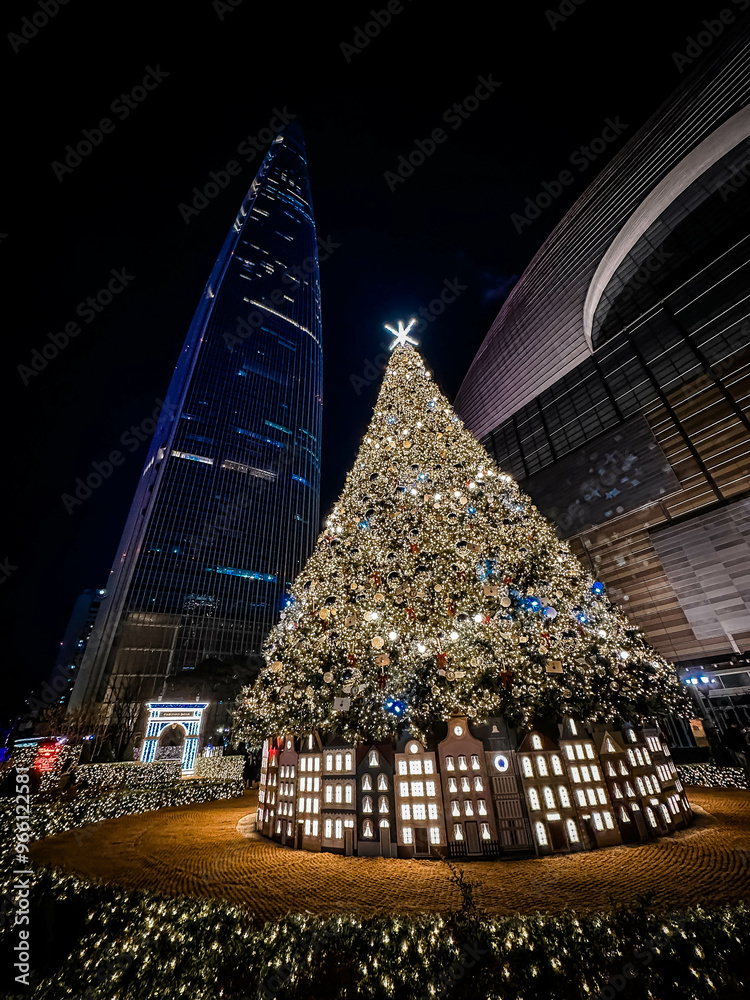 Christmas pine tree near Lotte World Tower. Seoul city, South Korea.