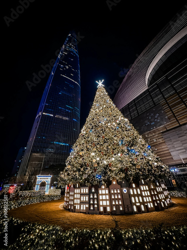Obraz na płótnie Christmas pine tree near Lotte World Tower. Seoul city, South Korea. w salonie