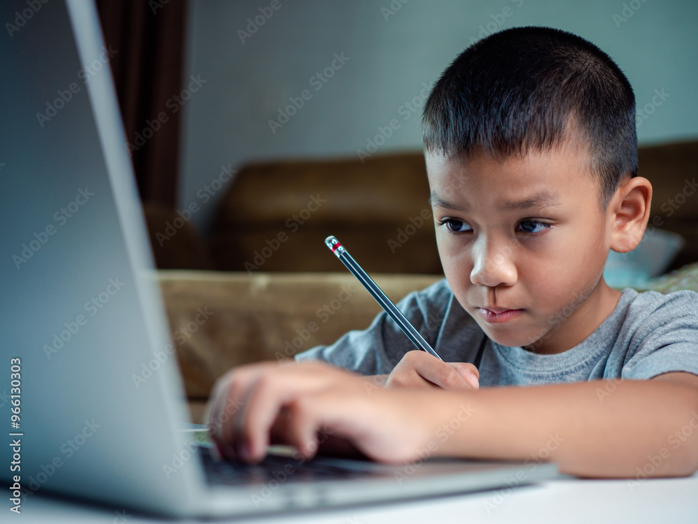 Technology studying at home using laptop computer, Student distance learning virtual distance online class on video call virtual lesson, Parent or tutor teaching child boy with remote education. Technology studying at home using laptop computer, Student distance learning virtual distance online class on video call virtual lesson, Parent or tutor teaching child boy with remote education.