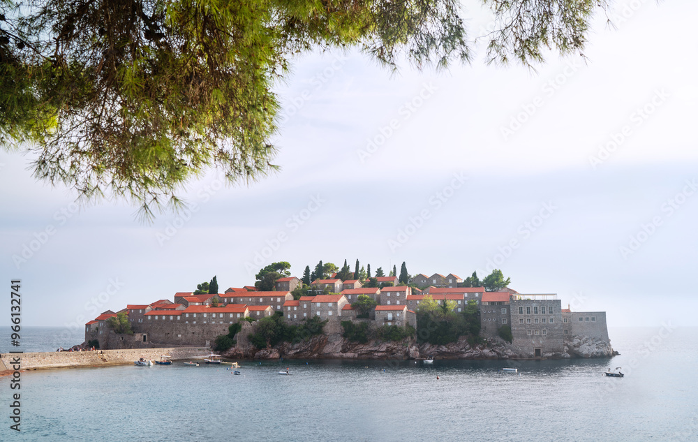 Sveti Stefan picturesque luxury hotel island in Montenegro showcasing its iconic red-roofed buildings surrounded by turquoise waters. Exclusivity of luxury resorts on Adriatic coast concept image. Sveti Stefan picturesque luxury hotel island in Montenegro showcasing its iconic red-roofed buildings surrounded by turquoise waters. Exclusivity of luxury resorts on Adriatic coast concept image.