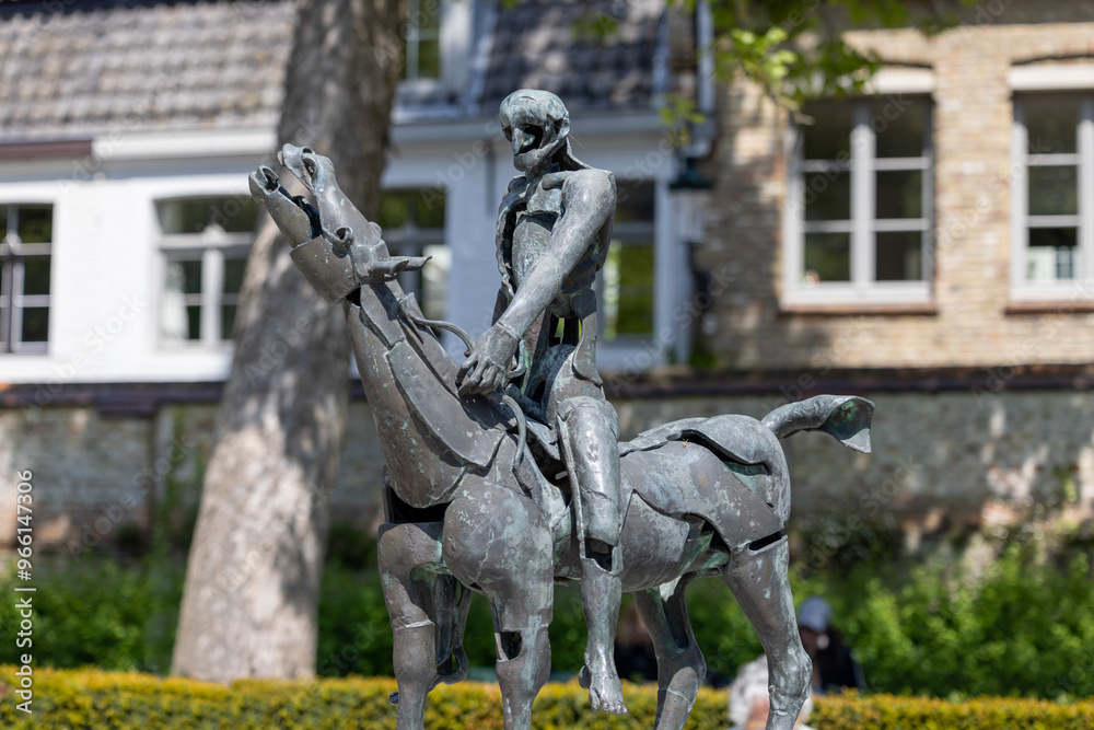 Obraz premium One of bronze statues show the Biblical Four Horsemen of the Apocalypse, Bruges, Belgium