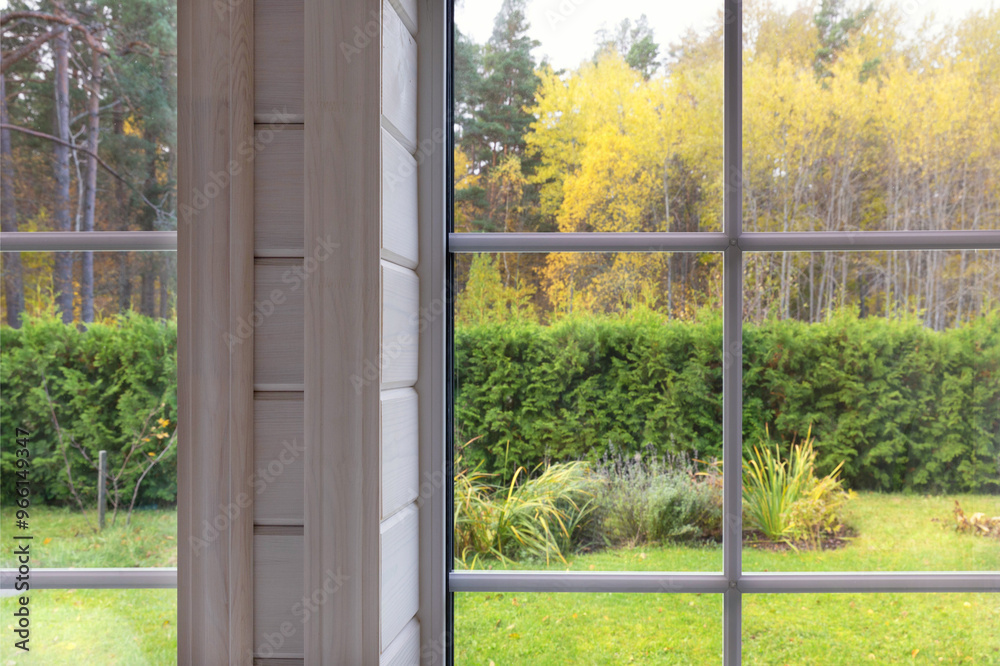 Cozy homely atmosphere. Knitted pumpkins and a warm scarf on the window. Autumn mood. Autumn outside the window Cozy homely atmosphere. Knitted pumpkins and a warm scarf on the window. Autumn mood. Autumn outside the window