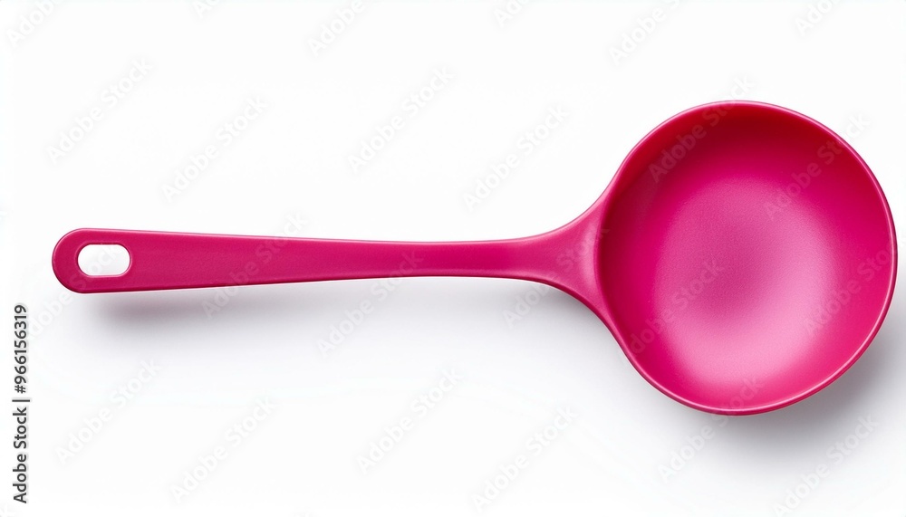 Pink plastic slotted spoon with a long handle isolated on a white background. Pink plastic slotted spoon with a long handle isolated on a white background.